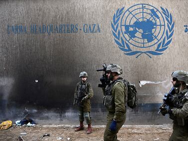 Israeli soldiers operate next to the UNRWA headquarters, amid the ongoing conflict between Israel and the Palestinian Islamist group Hamas, in the Gaza Strip, February 8, 2024. REUTERS/Dylan Martinez EDITOR'S NOTE: REUTERS PHOTOGRAPHS WERE REVIEWED BY THE IDF AS PART OF THE CONDITIONS OF THE EMBED. NO PHOTOS WERE REMOVED