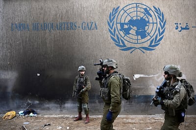 Israeli soldiers operate next to UNRWA headquarters in the Gaza Strip on February 8. An international investigation revealed on Monday that Israel had failed to provide evidence to support its allegations that UNRWA staff had links to extremists. Reuters