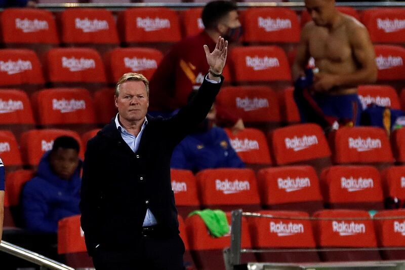 epa08721283 FC Barcelona's head coach Ronald Koeman gestures during the Spanish LaLiga soccer match between FC Barcelona and Sevilla FC at Camp Nou stadium in Barcelona, Catalonia, Spain, 04 October 2020.  EPA/ALBERTO ESTEVEZ