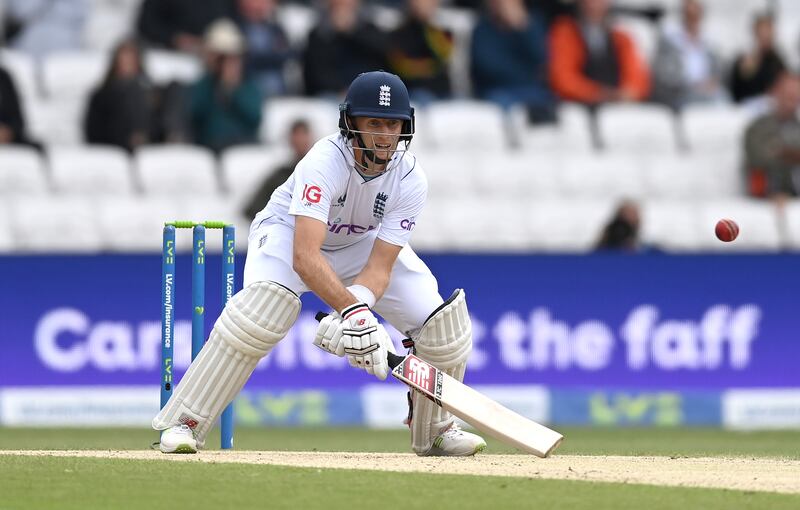 Joe Root of England plays a scoop shot. Getty