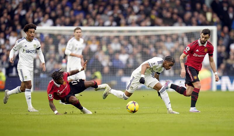 Leeds United's Crysencio Summerville and Manchester United's Fred battle. PA