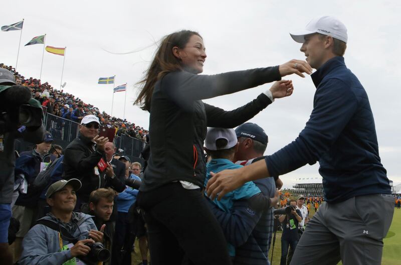 Winner Jordan Spieth of the United States is greeted by Sybi Kuchar, wife of runner-up Matt Kuchar of the United States, after the final round of the British Open Golf Championship, at Royal Birkdale, Southport, England, Sunday July 23, 2017. Dave Thompson / AP Photo