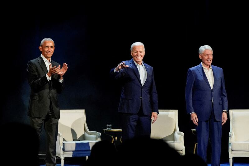 US President Joe Biden and former presidents Barack Obama and Bill Clinton at a campaign event in New York late on Thursday night. Reuters