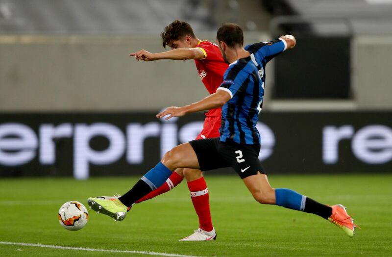 Kai Havertz of Bayer Leverkusen scores his sides first goal despite the attentions of Inter's Diego Godin. Getty