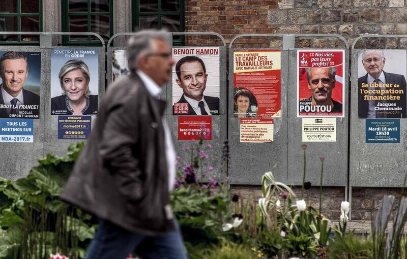campaign posters of French presidential election candidates in Bailleul, northern France, on April 21, 2017, two days before the first round of the election.  Philippe Huguen / AFP 

