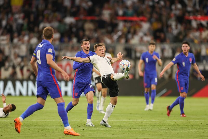 England's Mason Mount and Germany's Joshua Kimmich in action. EPA