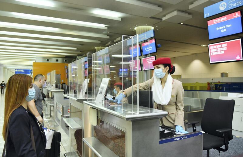 Protective barriers have been installed at Dubai International Airport at each check-in desk and immigration counter to provide additional safety reassurance to passengers and employees during interaction over the counter. Courtesy Emirates 