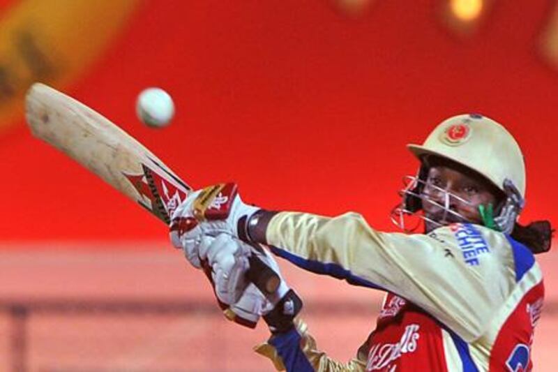 Royal Challengers Bangalore batsman Chris Gayle plays a shot during IPL Twenty20 cricket match between Royal Challengers Bangalore (RCB) and Pune Warriors (PW) at the M. Chinnaswamy Stadium in Bangalore on April 17, 2012. RCB is chasing a target of 183 runs set by PW with the loss of 6 wickets.   RESTRICTED TO EDITORIAL USE. MOBILE USE WITHIN NEWS PACKAGE. AFP PHOTO/ MANJUNATH KIRAN