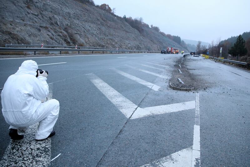 A forensic officer at the scene of a fatal bus crash on a motorway, 45 kilometres west of Bulgarian capital Sofia. Reuters