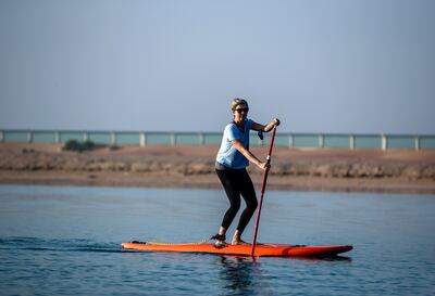 Parents can take part in stand-up paddle boarding and kayaking. Victor Besa / The National