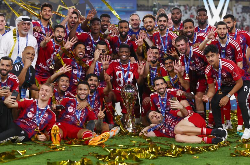 Sharjah celebrate with the League Cup trophy after beating Al Ain in the final at Al Nahyan Stadium. Getty