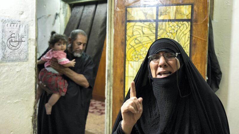 Layla Abbas Hussein, mother of two slain protesters crying over her sons. Haider Husseini for The National