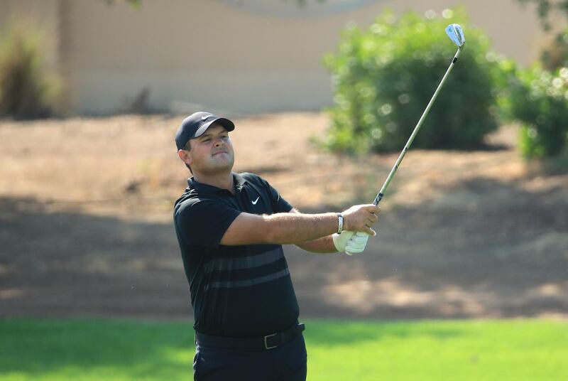 Patrick Reed  plays his second shot on the third hole at Jumeirah Golf Estates. Getty