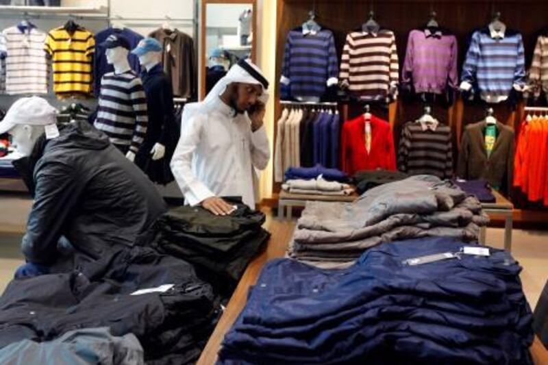 Dubai, United Arab Emirates-  November 23, 2010 ; Visitor browses the new collections at the Giordano store  in Dubai Mall   ( Satish Kumar / The National )