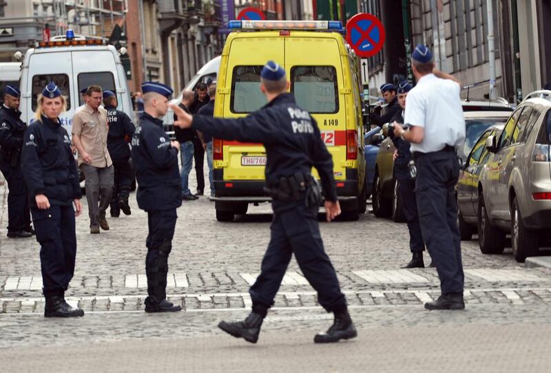 Police officers cordon off the area of a shooting near the Jewish Museum in Brussels on March 24. EPA