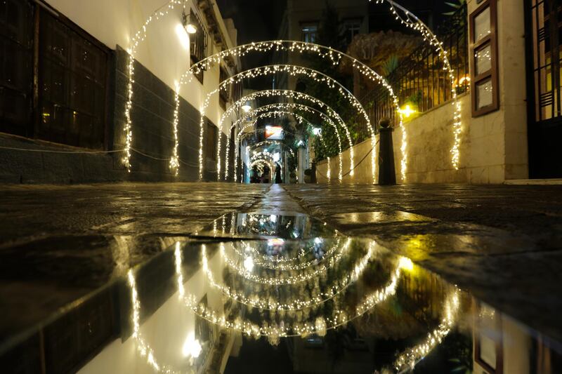 A street is decorated with lights in Bab Tuma neighborhood in Damascus, Syria. EPA