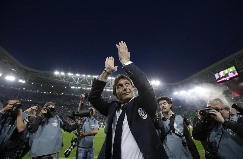 Former Juventus manager Antonio Conte shown applauding fans after leading the club to their third successive Serie A title in May 2014. Max Rossi / Reuters 