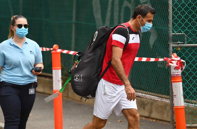 Croatia's Ivan Dodig walks to a practise session in Melbourne. AFP