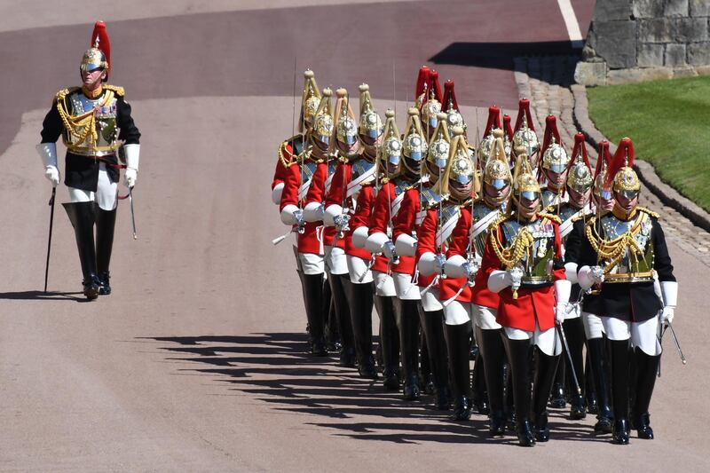 Members of the Household Cavalry march ahead of the funeral service of Prince Philip in Windsor Castle. Getty