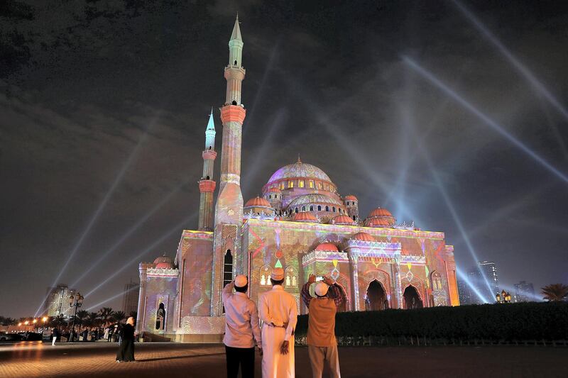 
SHARJAH , UNITED ARAB EMIRATES , FEB 7 – 2018 :- People taking photos of the Al Noor Masjid during the Sharjah Light Festival in Sharjah.  (Pawan Singh / The National) For News.

