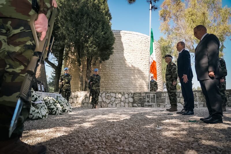 Ireland's Minister for Foreign Affairs and Minister for Defence, Micheal Martin, second right, pays his respects at a memorial to Irish soldiers in Lebanon