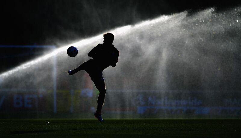 Jake Evans warms up ahead of a pre-season friendly between Swindon Town and Swansea City at County Ground in Swindon, England. Stu Forster / Getty Images