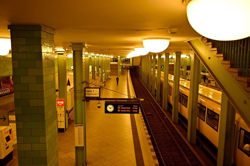 A train stands at a near-empty platform of a subway station at Alexanderplatz square in Berlin, as tourist activities came to a halt. AFP