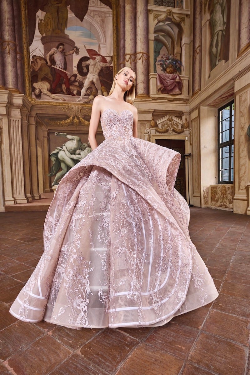 A couture gown embellished with pink threads