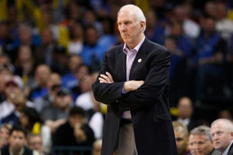 San Antonio Spurs head coach Gregg Popovich watches from the bench during the final seconds of his team's loss to the Oklahoma City Thunder in the second half of their NBA basketball game in Oklahoma City, Oklahoma April 4, 2013. REUTERS/Bill Waugh (UNITED STATES - Tags: SPORT BASKETBALL)