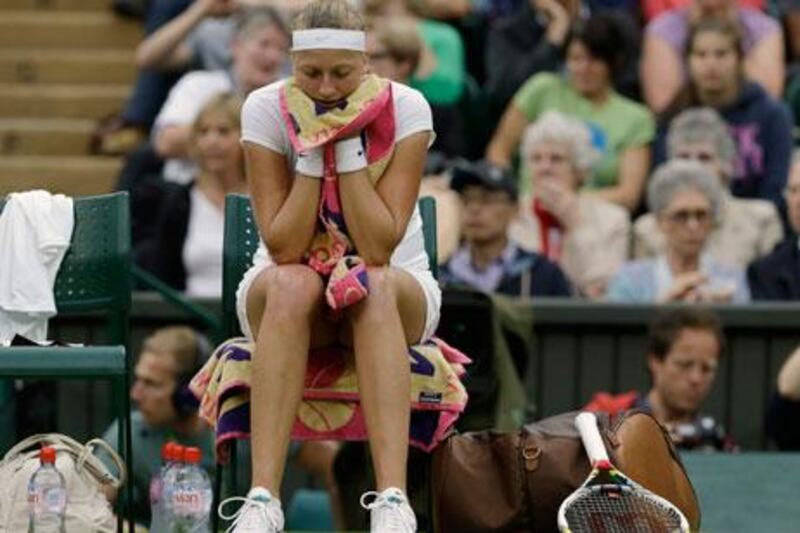 A dejected Petra Kvitova waits between sets against Serena Williams at Wimbledon