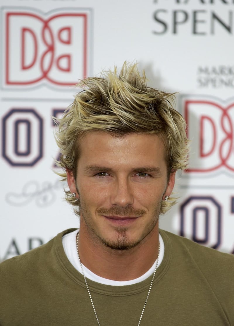 MANCHESTER - SEPTEMBER 19:  David Beckham of Manchester United at the unveiling of his range of boy's clothing for the company, DB07, at the Urbis Centre, Manchester, England on September 19, 2002. (Photo by Clive Brunskill/Getty Images). 
