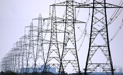 Relaxing planning rules to allow an expansion of Britain's power grid is one potential measure that would not involve spending billions. EPA 