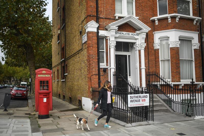 A woman is seen walking her dog in Maida Vale. Getty Images