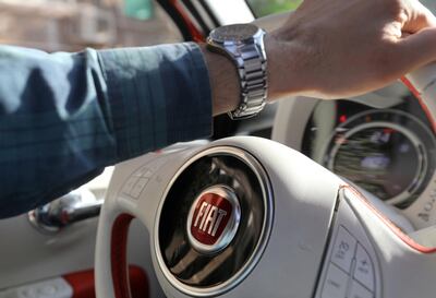 FILE PHOTO: The logo of FIAT carmaker is seen on a steering wheel in Cairo, Egypt, May 19, 2019. Picture taken May 19, 2019. REUTERS/Mohamed Abd El Ghany/File Photo