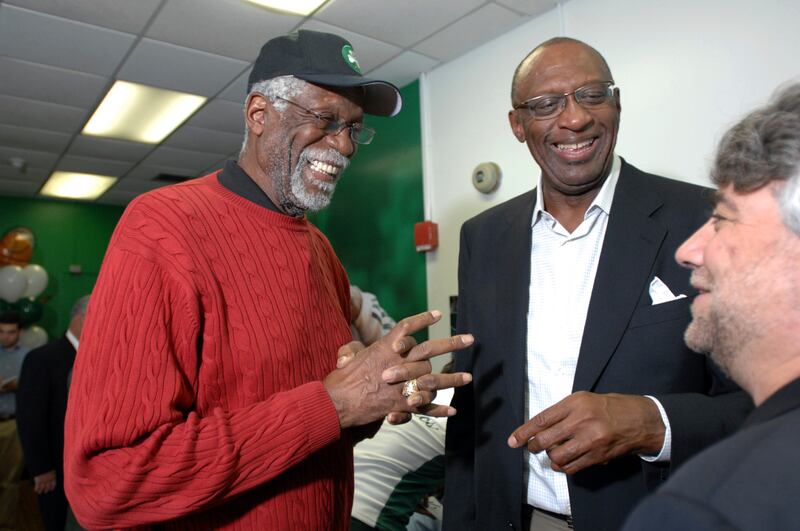 Former NBA players Bill Russell, left, and Bob Lanier share a laugh during the ceremonial opening of a new reading and learning centre at a community centre in Boston. AP