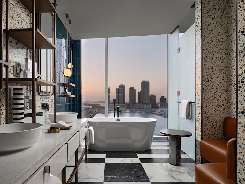 A free-standing bath tub offers stellar views.