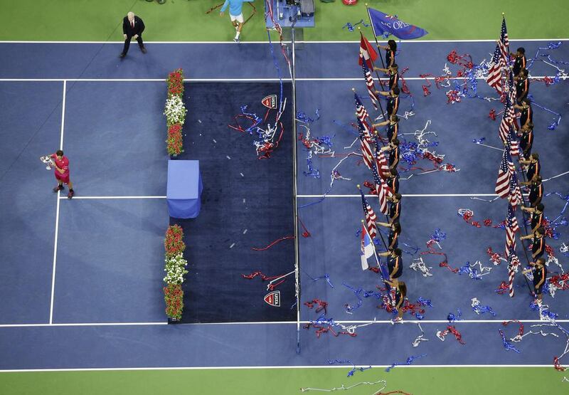 Stan Wawrinka holds up the championship trophy after beating Novak Djokovic. Julie Jacobson / AP Photo