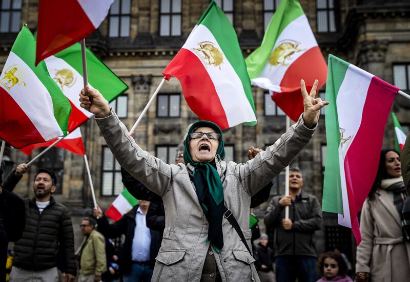 Iranian activists shout slogans during a protest against the government in Tehran, in Amsterdam, The Netherlands. EPA