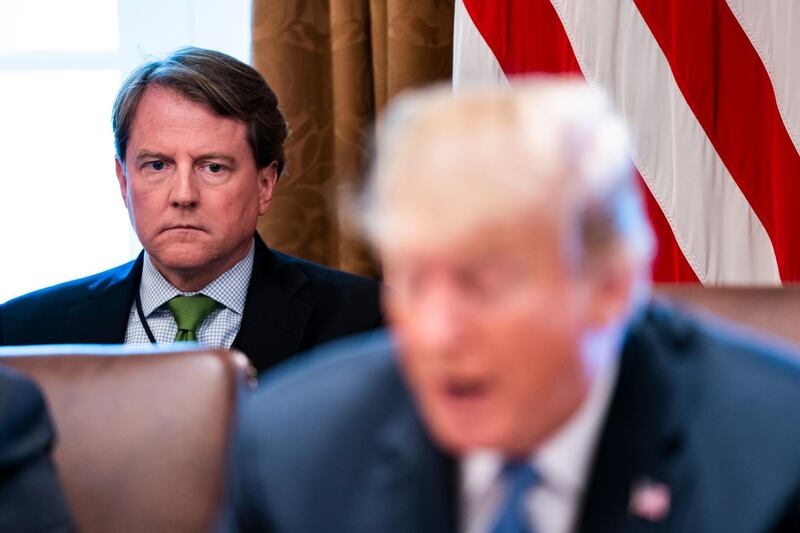 epa06981509 (FILE) - White House counsel Don McGahn (L) listens to President Donald J. Trump speak to the media before meeting with members of his administration in the Cabinet Room of the White House Washington, DC, USA 21 June 2018, (reissued 29 August 2018). According to reports on 29 August 2018, US President Donald J. Trump has announced on his twitter account that Donald McGahn, White House Counsel, will leave his post this fall.  EPA/JIM LO SCALZO *** Local Caption *** 54428969