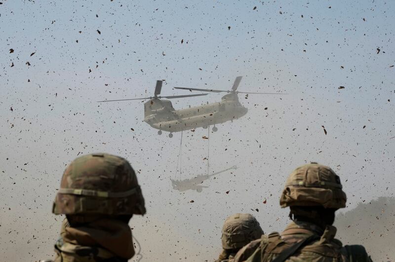 A US Army CH-47 Chinook helicopter lifts a M777 howitzer during a joint military drill between South Korean and US at Rodriguez Live Fire Complex in Pocheon, South Korea. AP