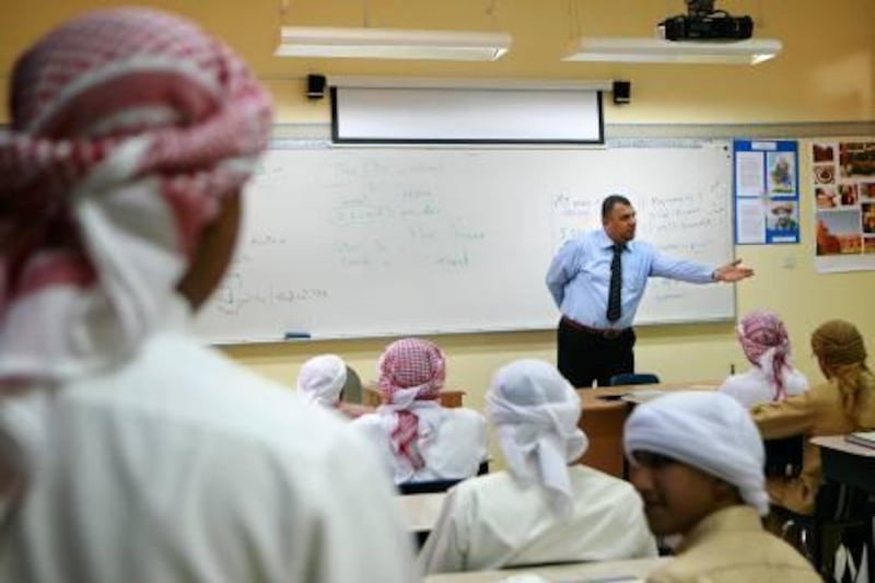 Abu Dhabi - September 28, 2009: Students at Al Ittihad Model School study english in class.  ( Philip Cheung / The National ) 

 *** Local Caption ***  PC0010-SchoolStock.JPG