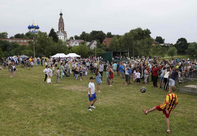People attend the party organised by the village of Bronnitsy, where Argentina's base camp is located, near Moscow, Russia, to celebrate the birthday of Argentine forward Lionel Messi. AFP