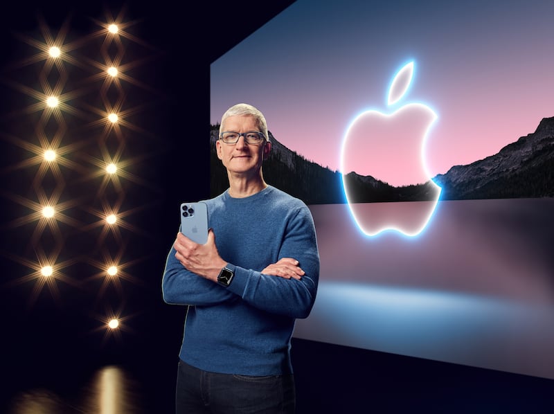 Apple CEO Tim Cook with the iPhone 13 Pro Max and Apple Watch Series 7. Courtesy Apple