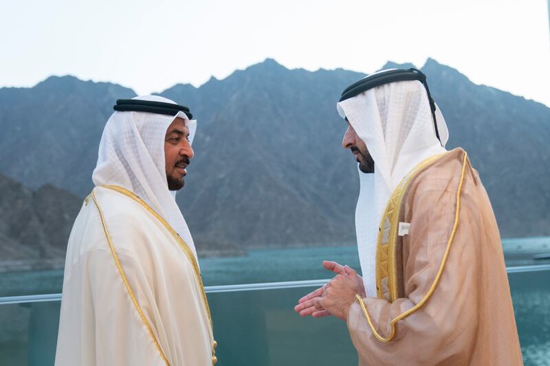 Sheikh Hamdan bin Zayed, Ruler’s Representative in Al Dhafra Region, left, speaks with Sheikh Hamdan bin Mohammed, Crown Prince of Dubai.