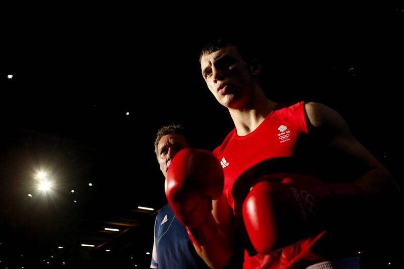 LONDON, ENGLAND - AUGUST 12:  Freddie Evans of Great Britain walks to the ring to take on Serik Sapiyev of Kazakhstan during the Men's Welter (69kg) Boxing final bout on Day 16 of the London 2012 Olympic Games at ExCeL on August 12, 2012 in London, England.  (Photo by Scott Heavey/Getty Images) *** Local Caption ***  150215513.jpg