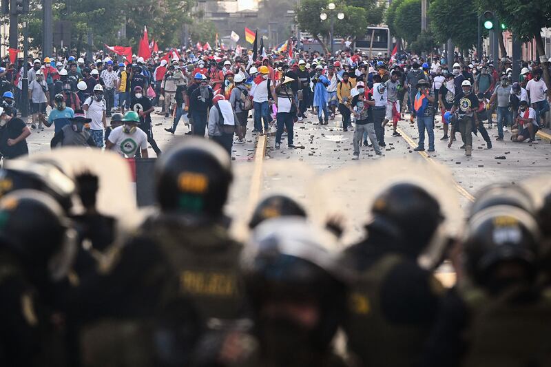 Demonstrators and police clash in Lima, Peru, during a protest against President Dina Boluarte's government. AFP

