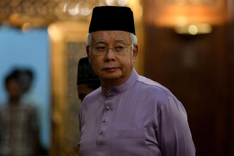 Malaysia's former prime minister Najib Razak waits to attend Friday prayers at the Barisan Nasional party headquarters in Kuala Lumpur on May 18, 2018.  Just last week, 64-year-old Najib was widely expected to lead his powerful Barisan Nasional (National Front) political machine to victory, extending a more than six-decade reign that had made it one of the world's longest-serving governments. But his coalition -- accused of ballot-box stuffing and gerrymandering -- was unexpectedly trounced by a diverse alliance that rallied public support against Najib's suspected corruption and increasingly repressive tactics. / AFP / Mohd RASFAN
