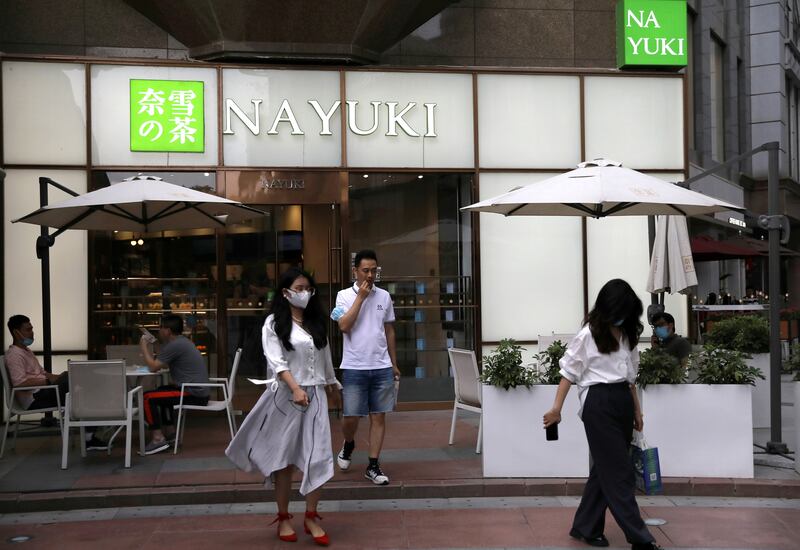 Customers leave a store of Chinese bubble tea chain Nayuki in Beijing. Reuters