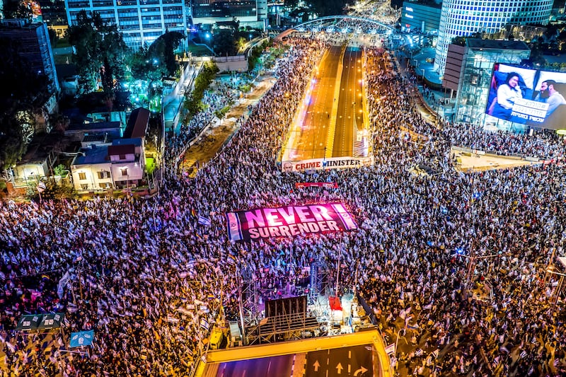 An aerial view shows people protesting as Israeli Prime Minister Benjamin Netanyahu's nationalist coalition government presses on with its contentious judicial overhaul, in Tel Aviv, Israel, March 18, 2023. Reuters