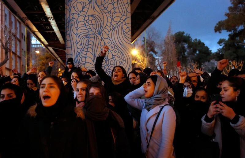 epaselect epa08120575 Iranians protest to show their sympathy to victims of Ukraine International Airlines Boeing 737-800 in front of the Amir Kabir University in Tehran, Iran, 11 January 2020. The Iranian military released a statement on 11 January 2020 that Ukraine International Airlines flight PS752 was shot down due to 'human error.' The passemger jet en route from Tehran to Kiev crashed minutes after takeoff on 08 January 2020, all all 167 passengers and nine crew members aboard were killed.  EPA/ABEDIN TAHERKENAREH